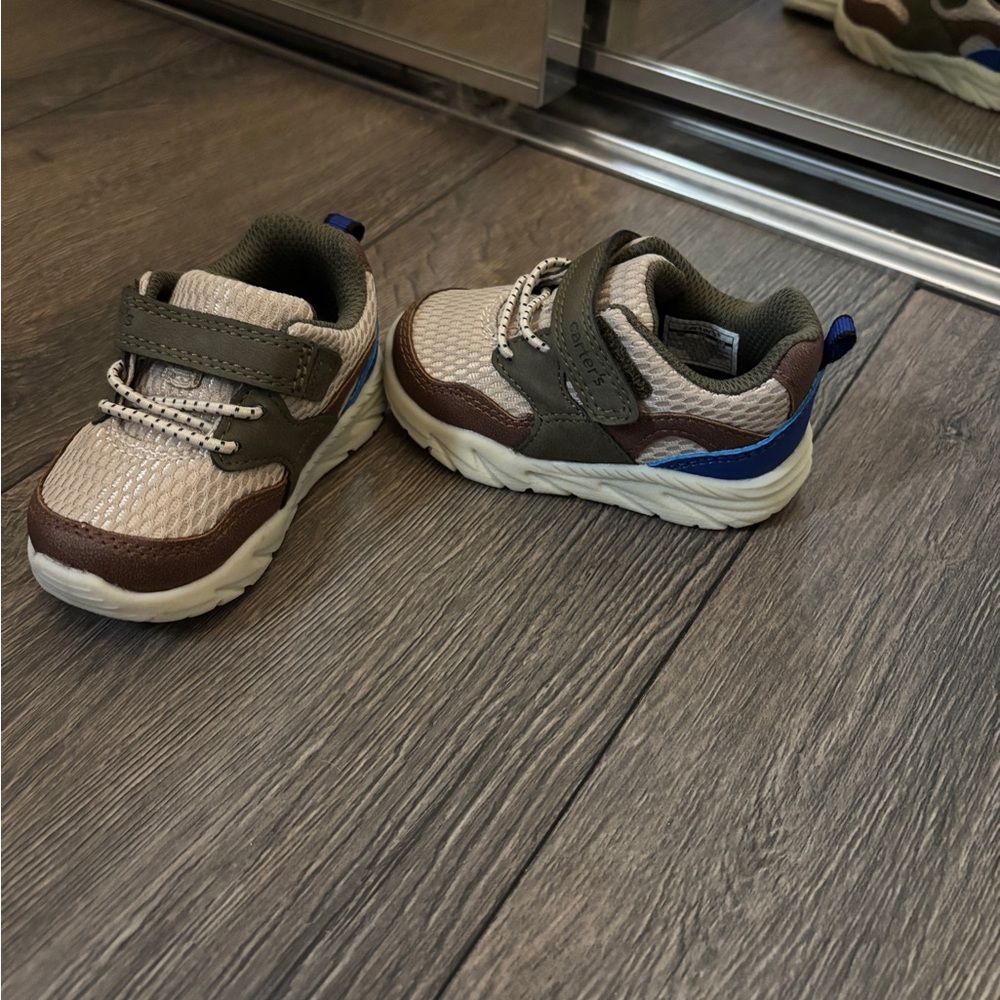Green and tan baby sneakers